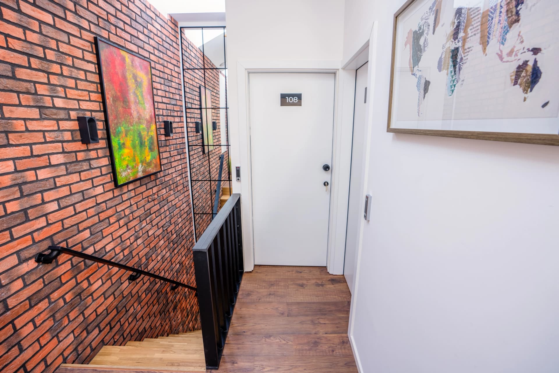 Hallway with brick accents and room entrance